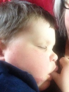 Griffin recovering from getting his tonsils removed. Grandma snuggles are the best!